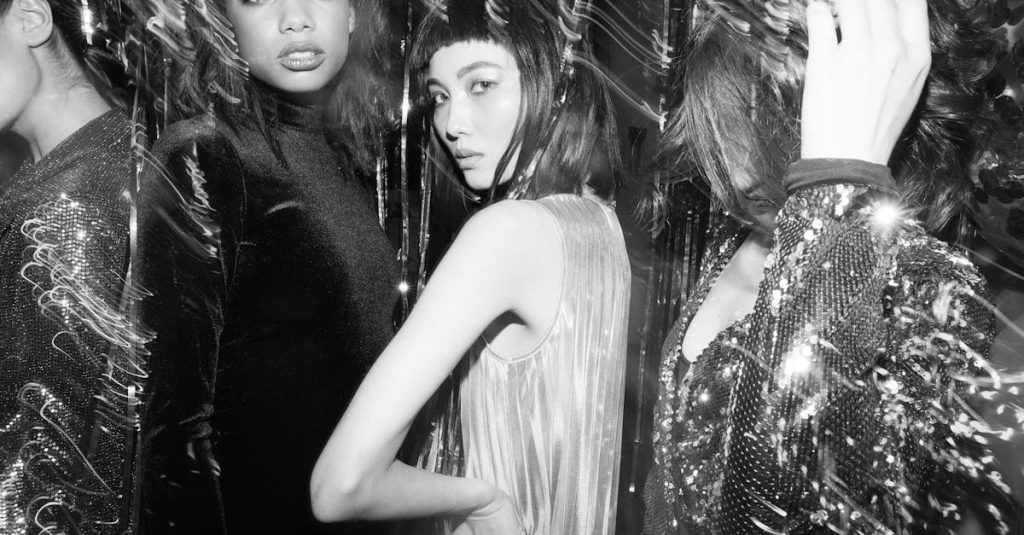 Stylish portraits of fashionable women at a lively party in monochrome.