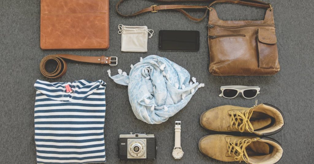 Vintage travel essentials flat lay with leather bags, shoes, camera, and clothing.